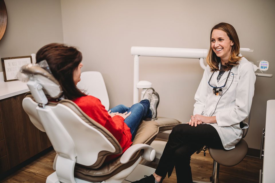 dentist talking with patient